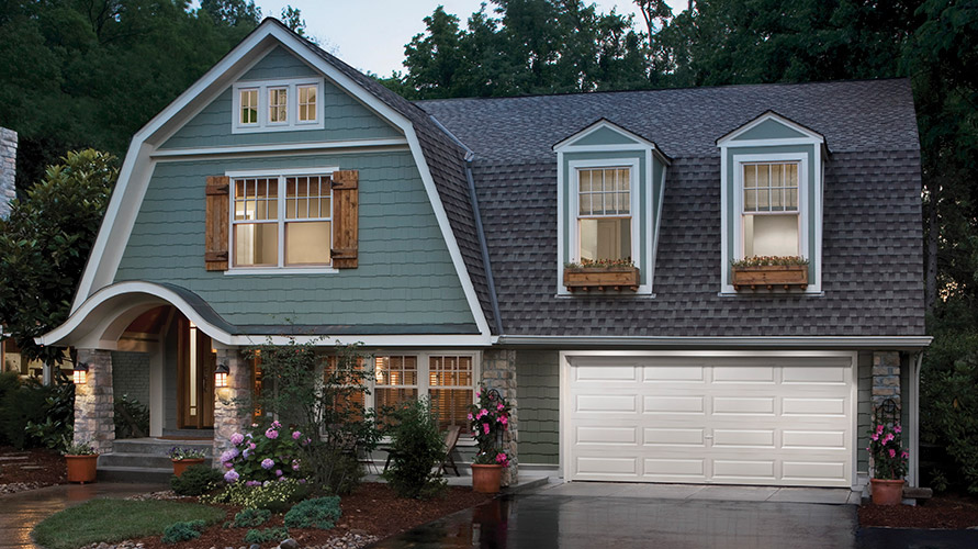 colorful house with white garage doors